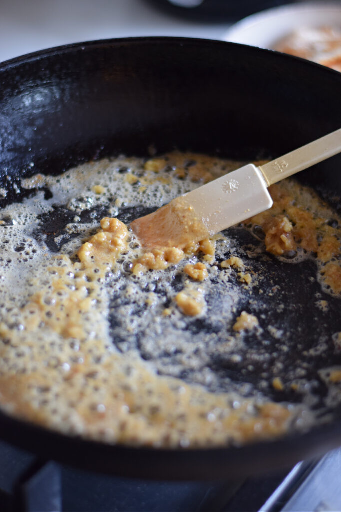 Making a sauce in a skillet.