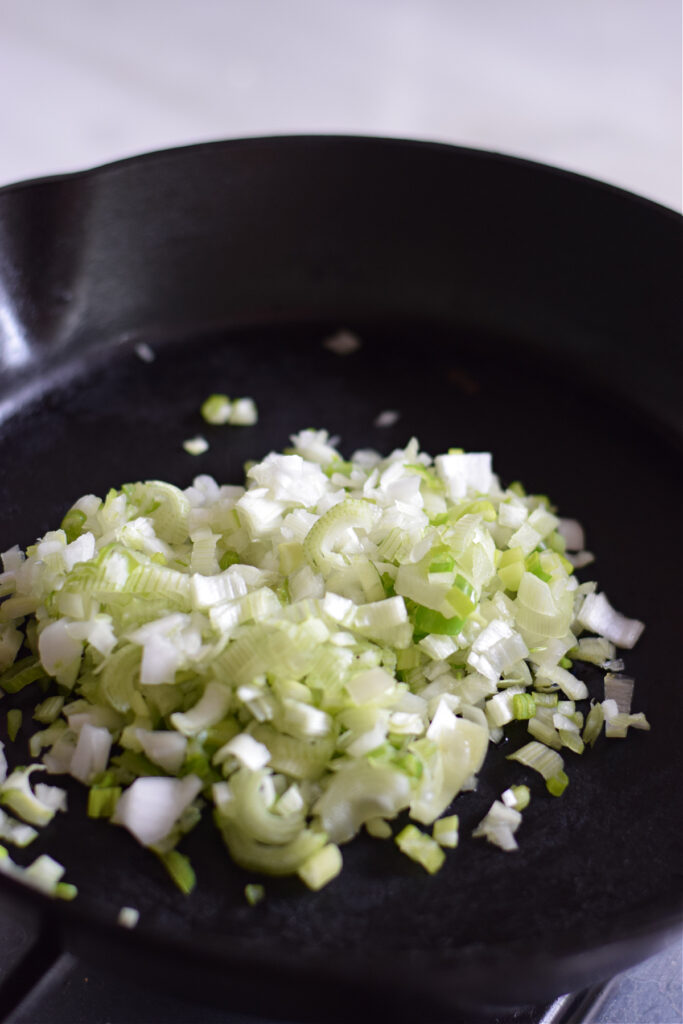 Cooking onions in a skillet.