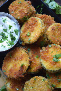 Close up of panko fried zucchini on a tray.