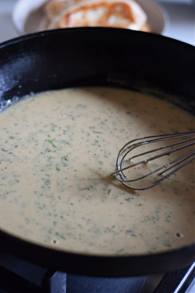 Making a sauce in a skillet.