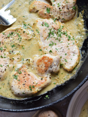 dijon-mustard-turkey-cutlets-image Close up of turkey cutlets with Dijon mustard.