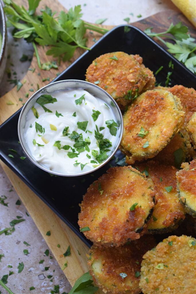 Panko crusted zucchini with a dip.
