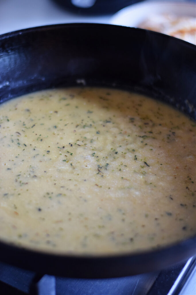Creamy Dijon sauce in a skillet.