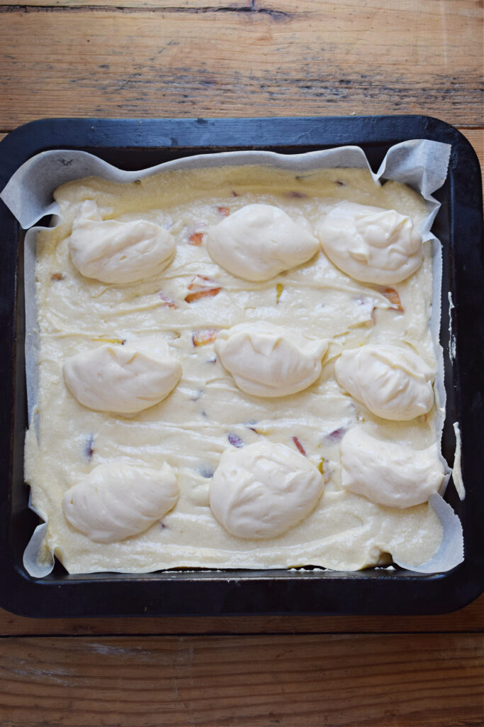 Ready to bake cake in a square pan.