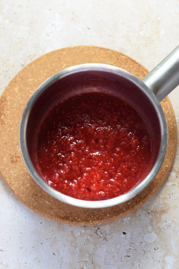 Raspberry compote in a saucepan.