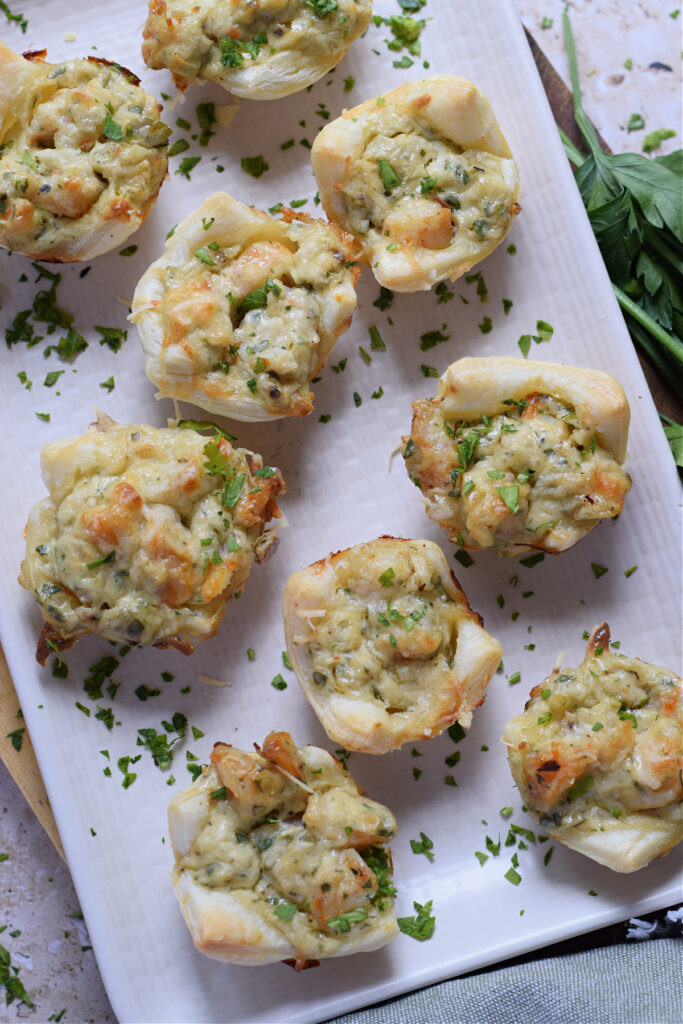 Shrimp appetizers on a white plate.