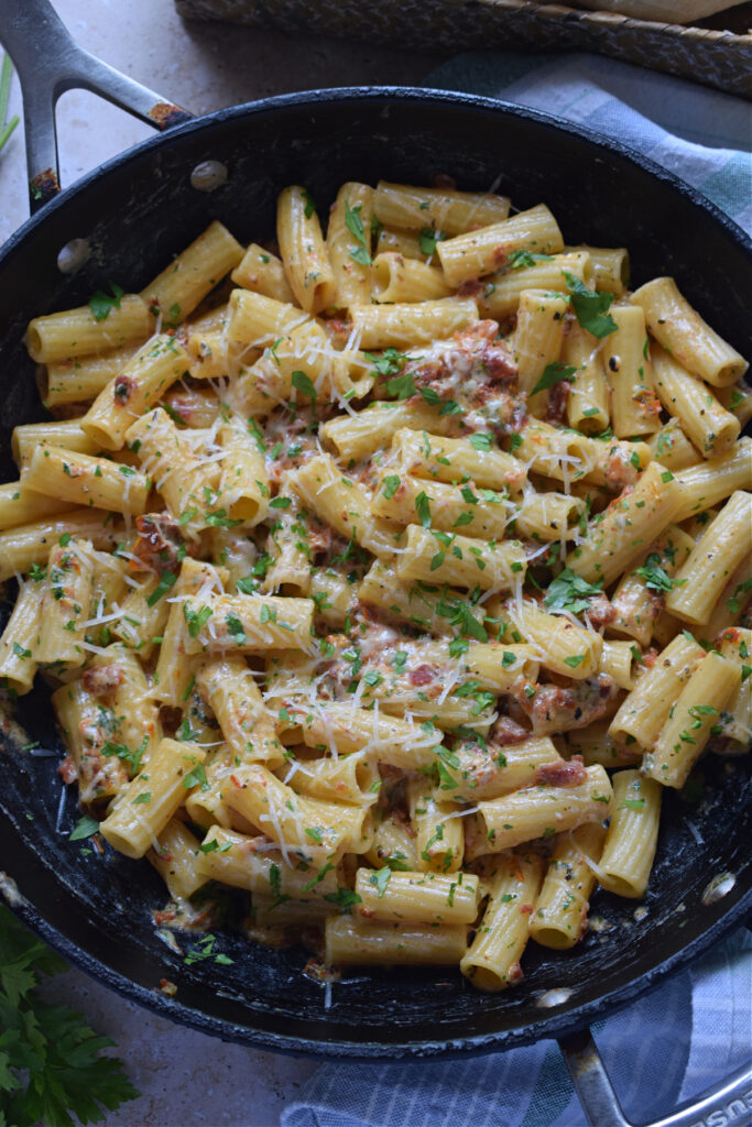 Sun dried tomato pasta in a skillet.