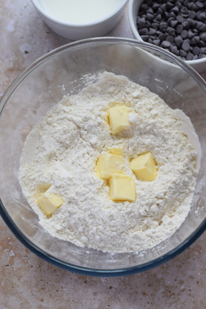 Adding cold butter to scones.