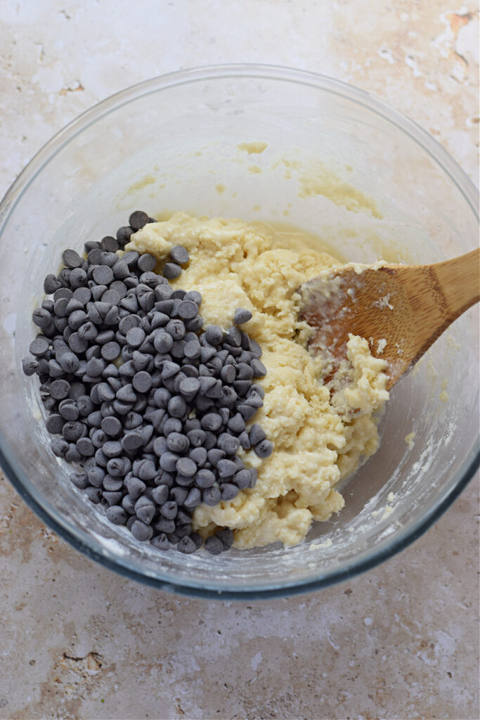 Adding chocolate chips to scone batter.