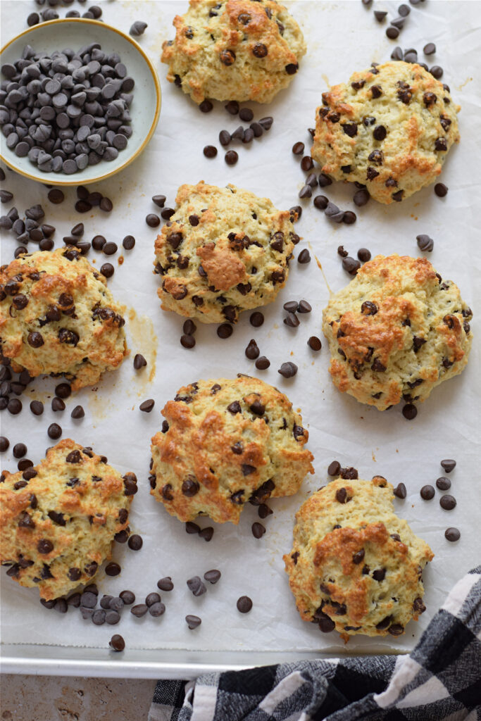 Chocolate chip scones on a baking tray.