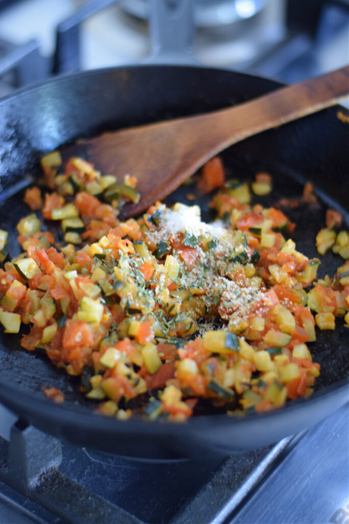 Cooking vegetables in a skillet.
