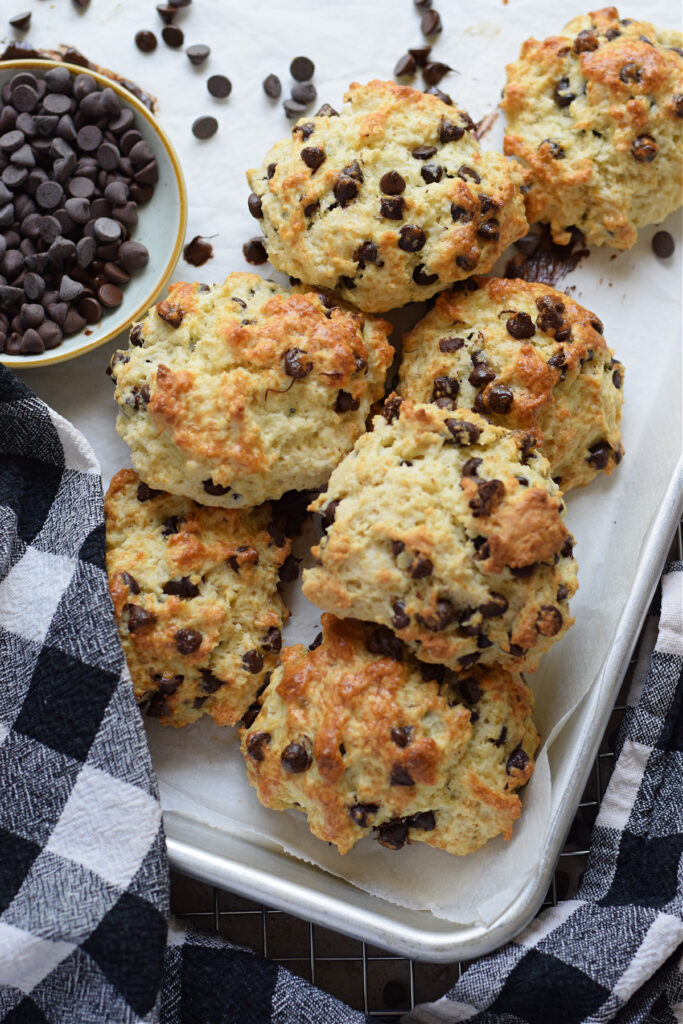 Chocolate chip scones on a white plate.