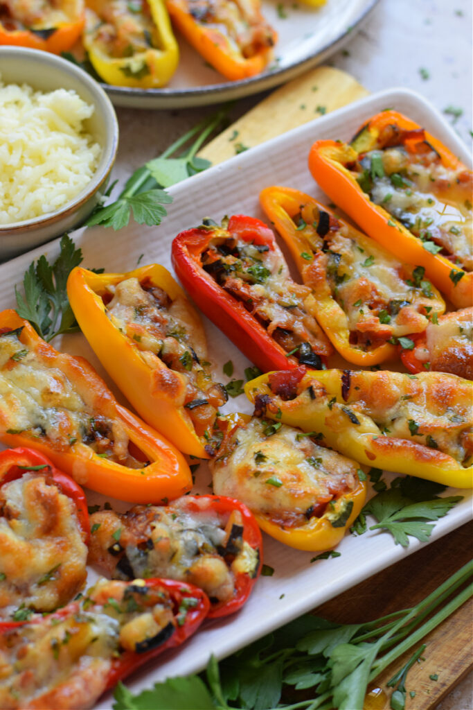 Close up of peppers on a white plate.