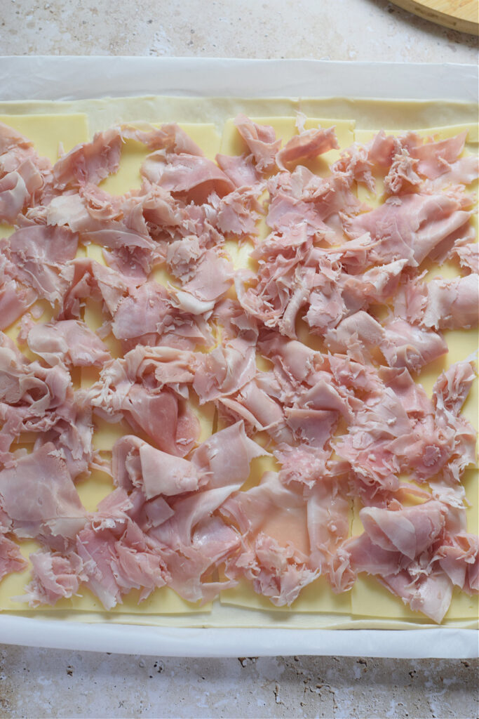 Ham topped on puff pastry.