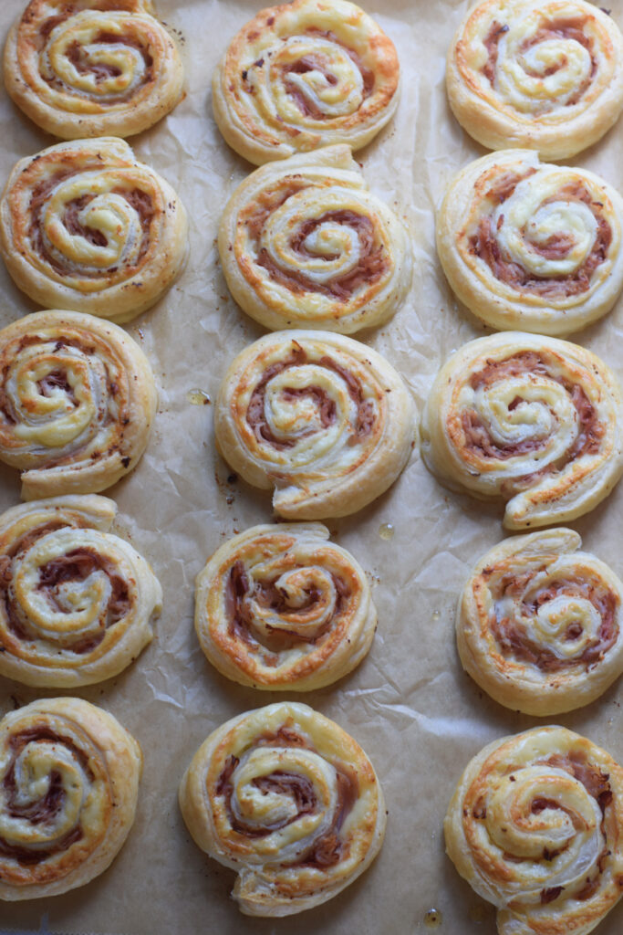 Baked pinwheels on a tray.