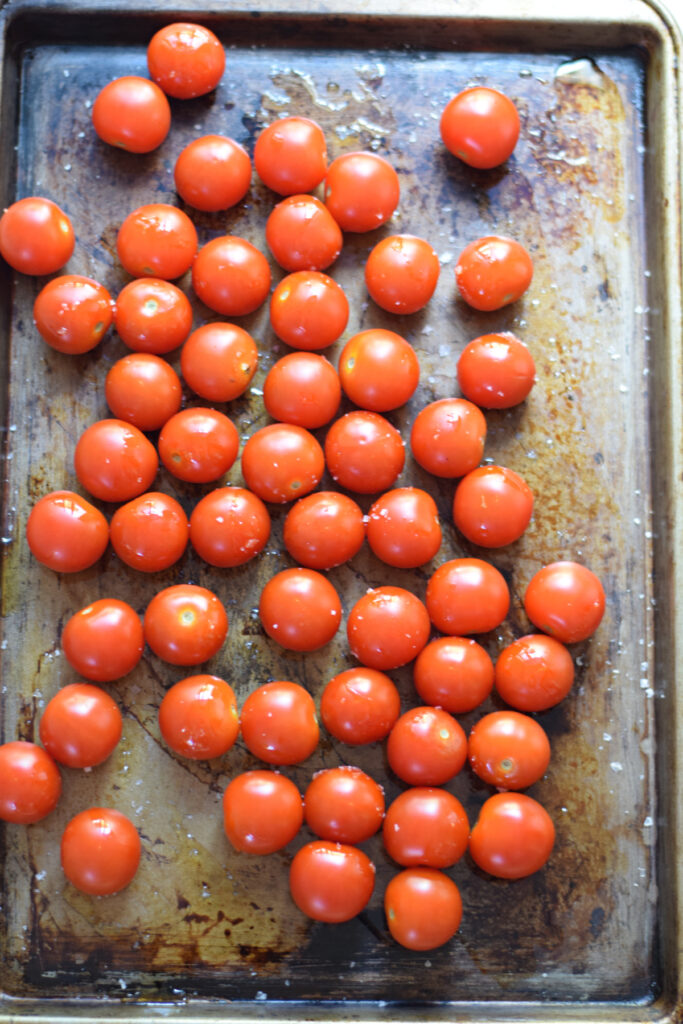 Cherry tomatoes on a roasting tray.