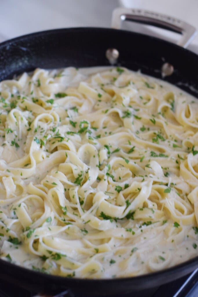Creamy tagliatelle in a skillet.