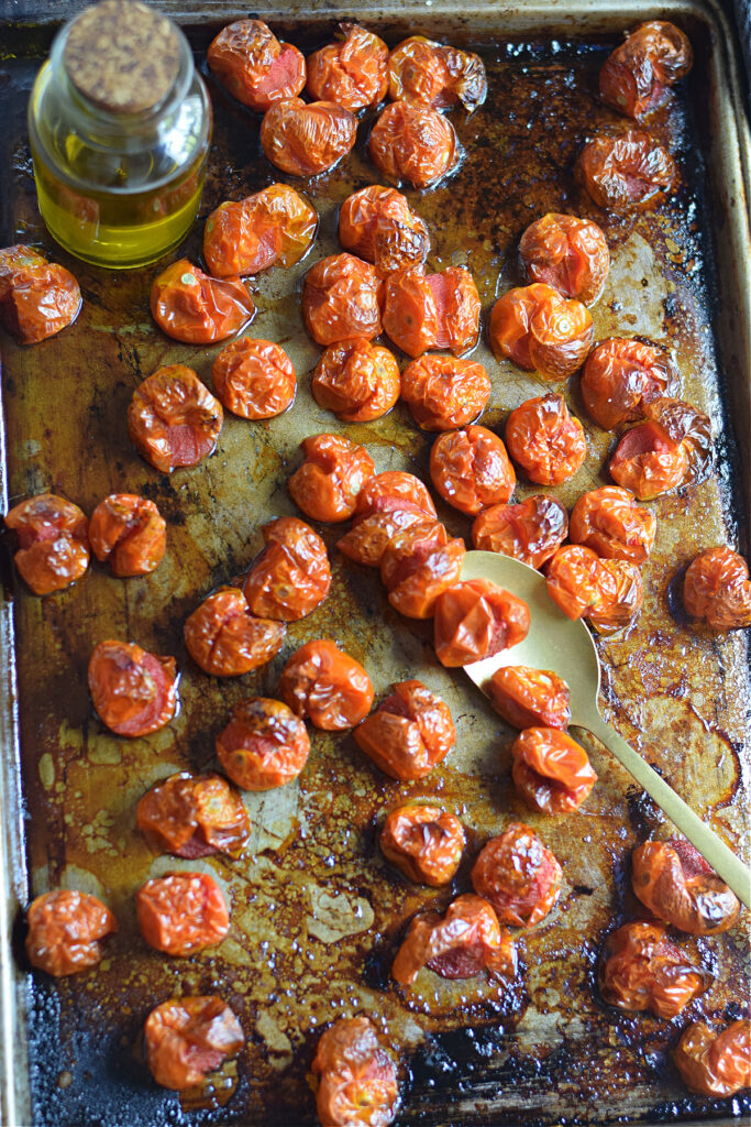 Slow roasted cherry tomatoes on a tray.