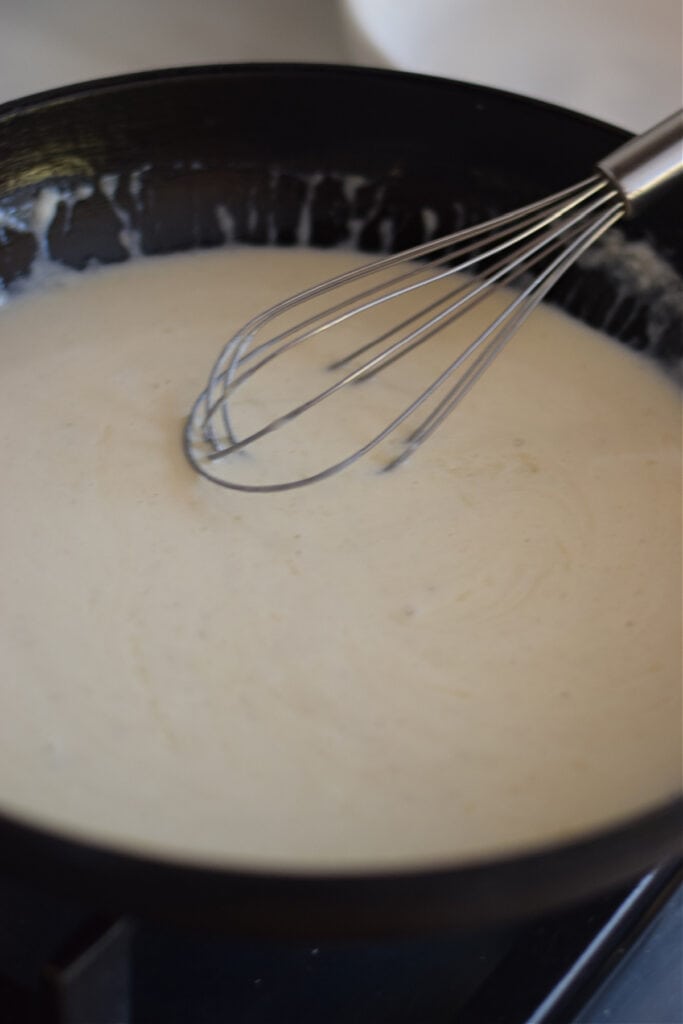 Making a creamy pasta sauce.