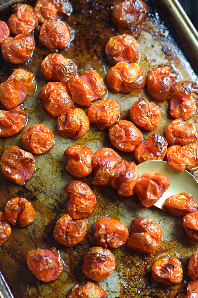 Slow roasted cherry tomatoes on a tray.