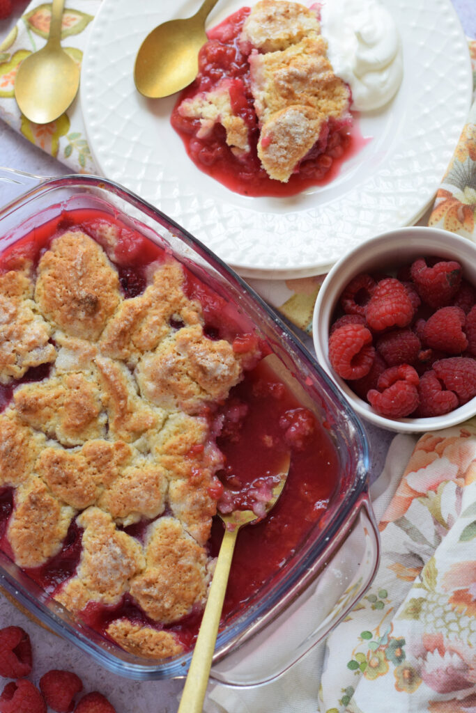 Raspberry cobbler on a plate and in a serving dish.