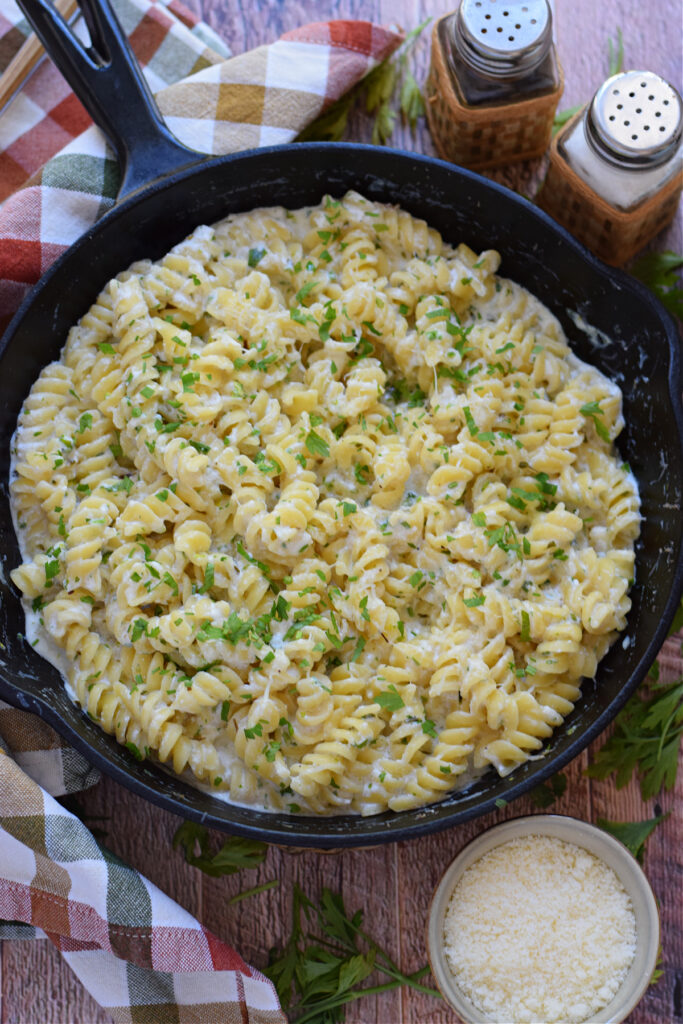 Creamy pasta with ricotta in a skillet.