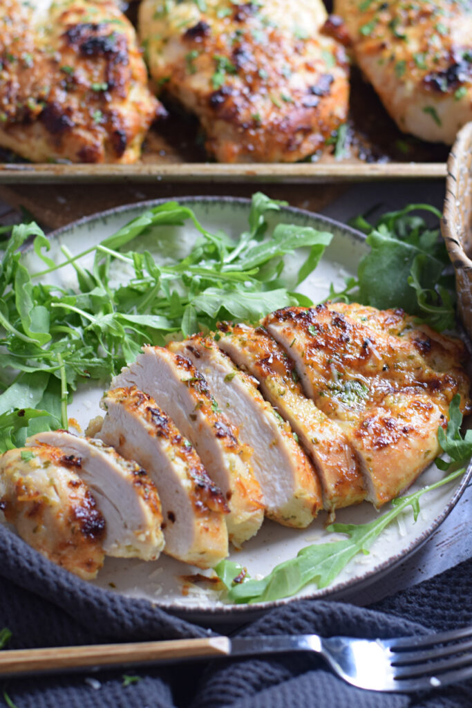 Sliced chicken breast on a white plate.