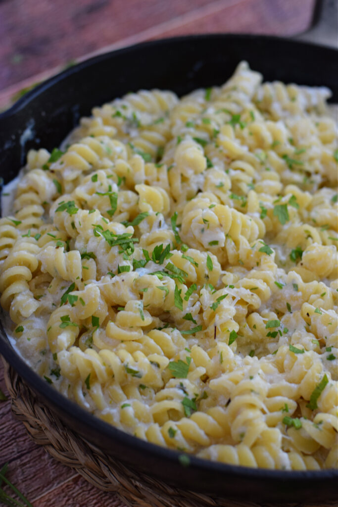 Close up of creamy ricotta pasta in a skillet.