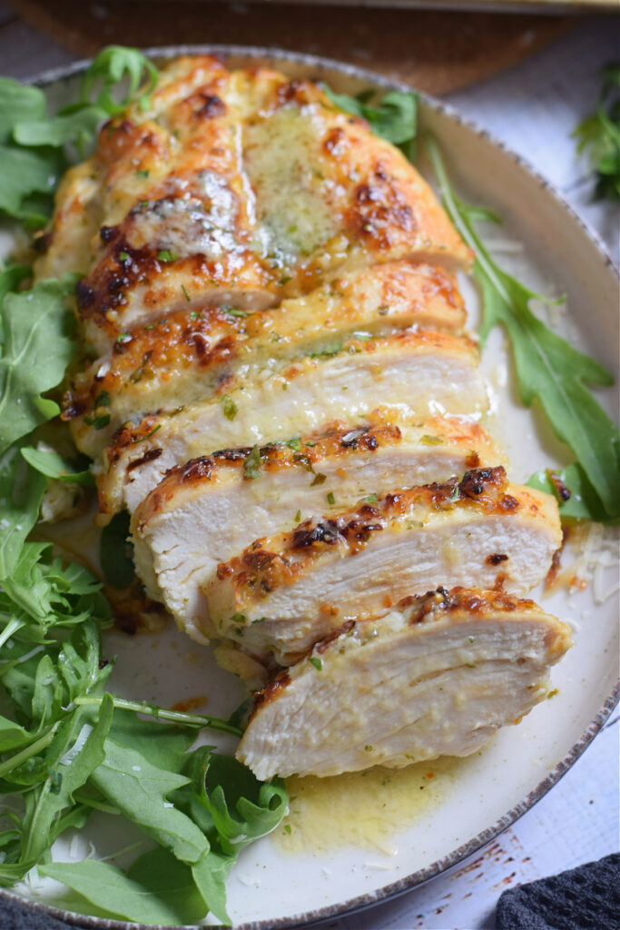 Honey garlic chicken breast on a plate.