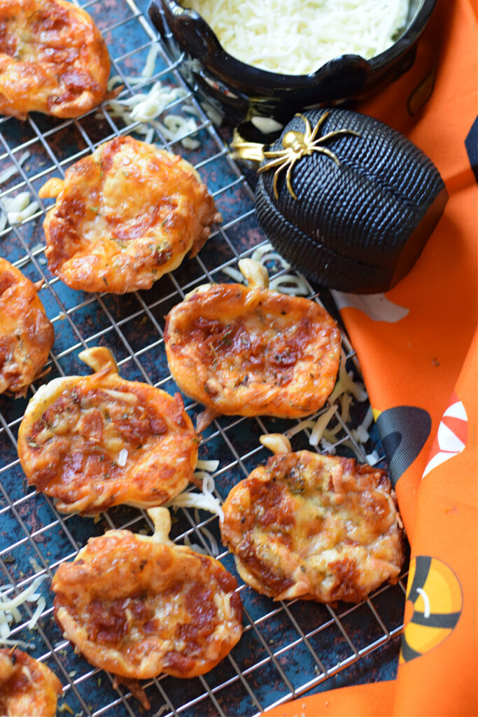Halloween puff patry mini pizzas with halloween decorations.