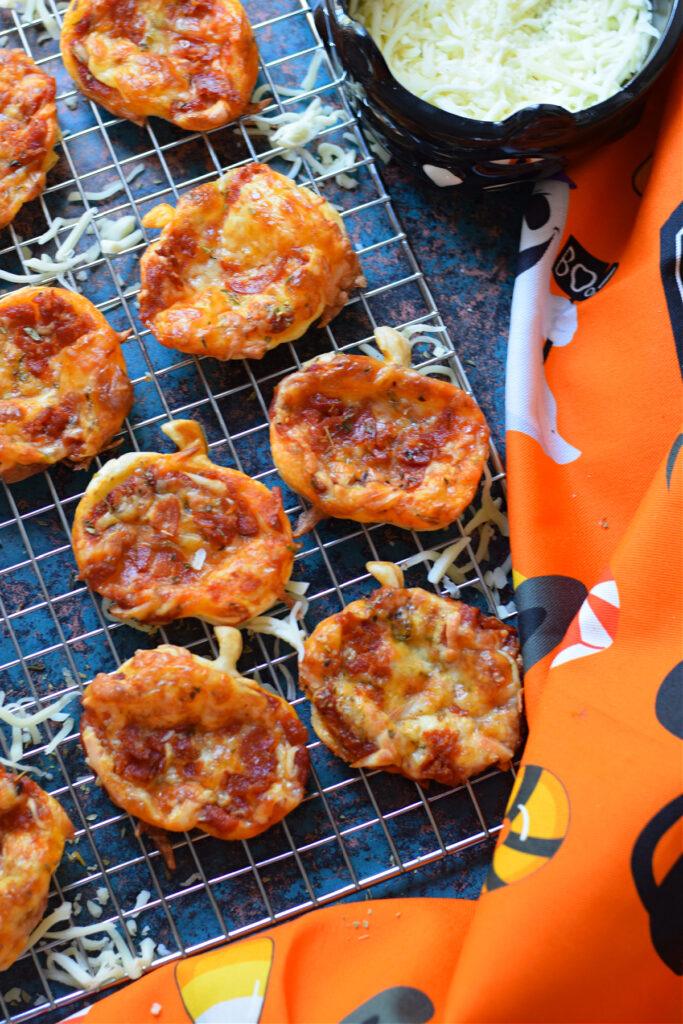 Halloween puff pastry pizza on a baking tray.