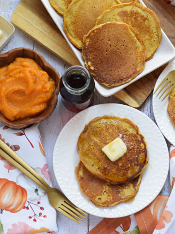 Buttermilk pumpkin pancakes on serving plates.
