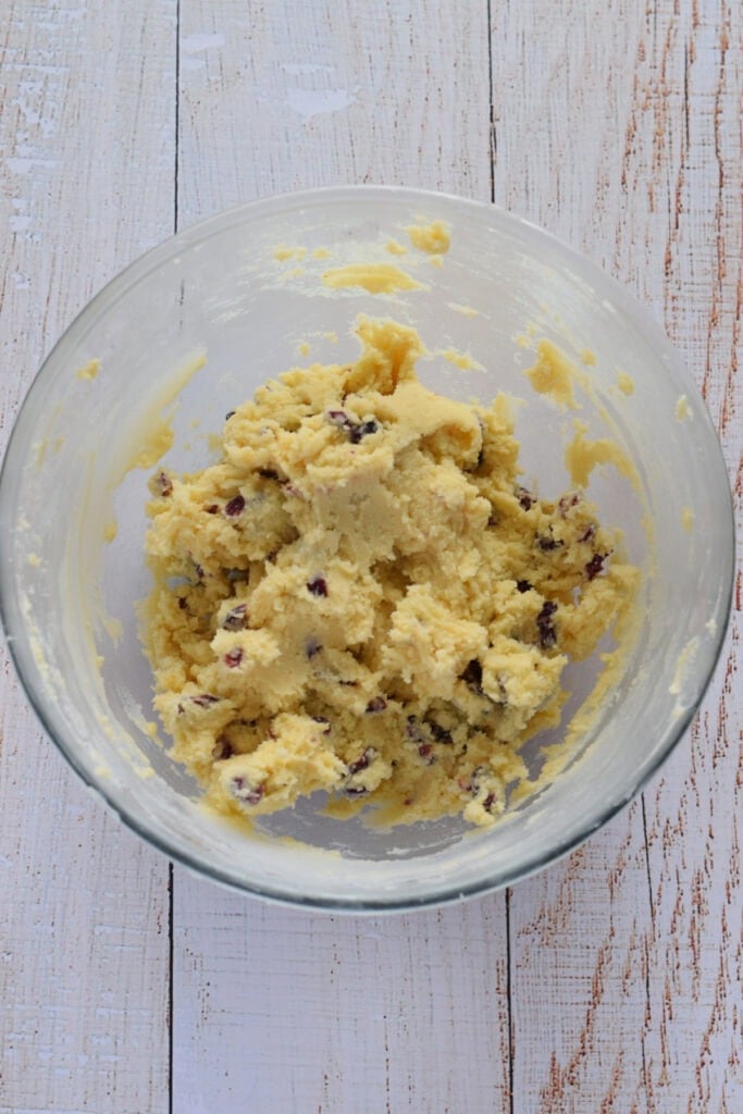 Cranberry shortbread cookie dough in a glass bowl.