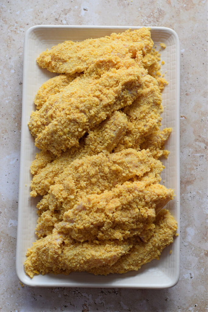 Breaded chicken strips ready to cook.