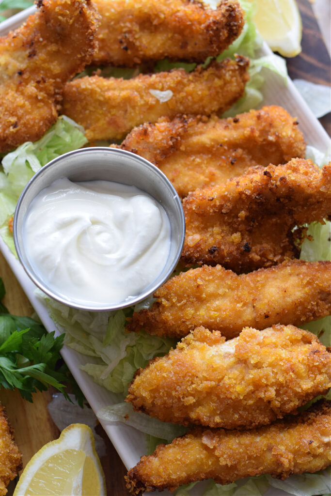 Crispy chicken strips with a yogurt dip.