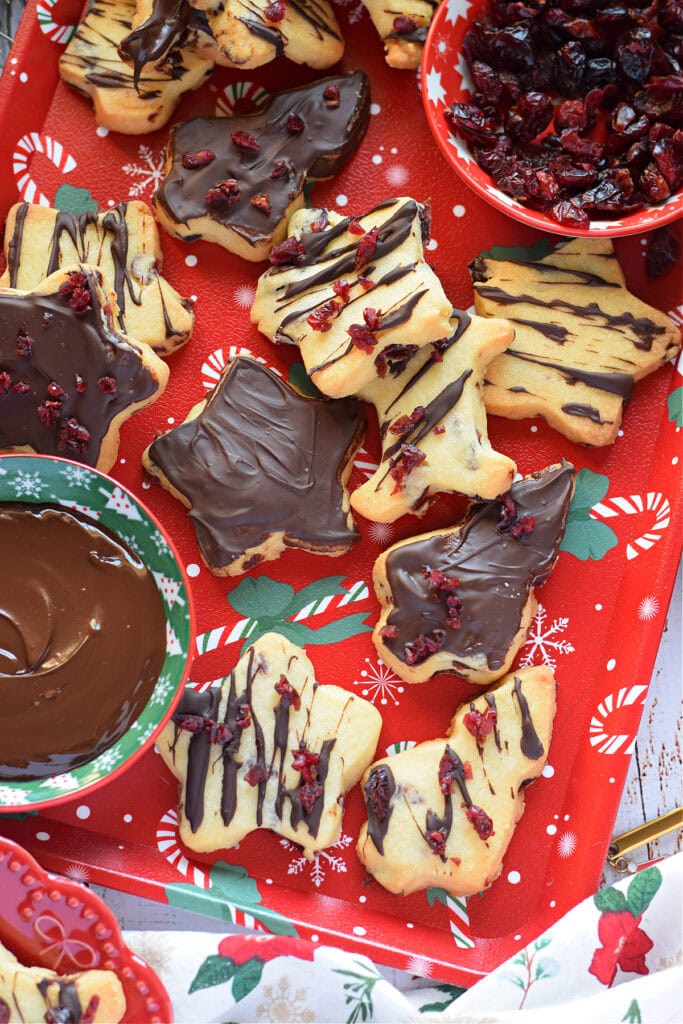 Dark chocolate cranberry shortbread on a Christmas tray.