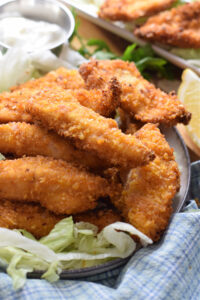 Close up of indian style fried chicken strips.