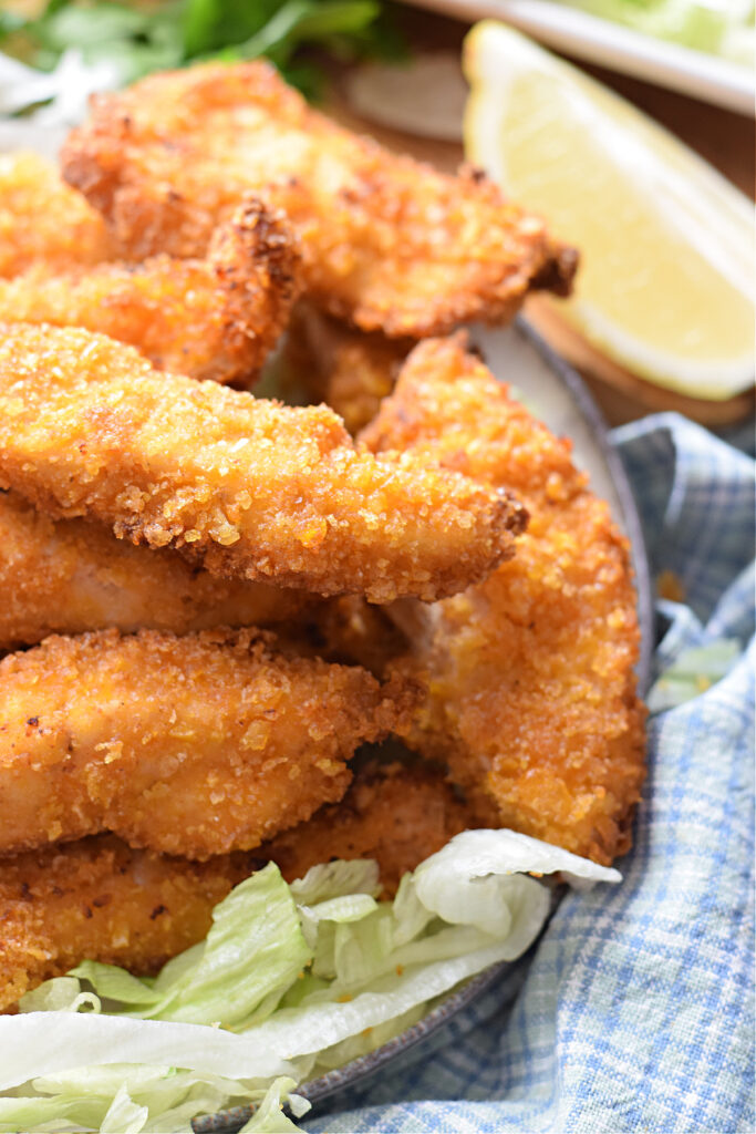 Close up of fried chicken on a plate.