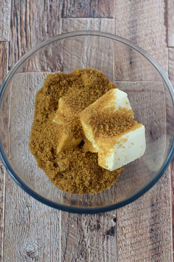Brown sugar and butter in a glass bowl.