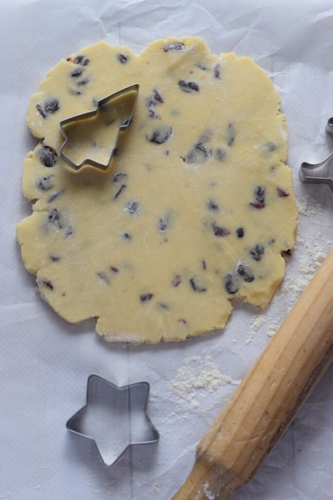 Cookie dough on a sheet of parchment paper.