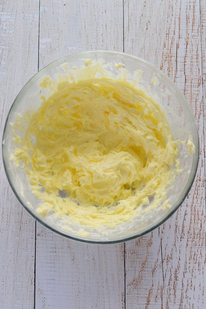 Whipped butter and sugar in a bowl.