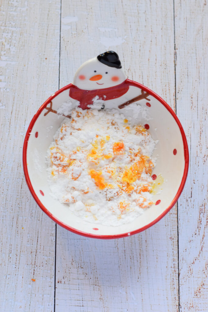 Combined sugar with orange zest.