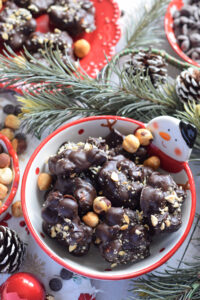 Chocolate hazelnut clusters in a snowman bowl.