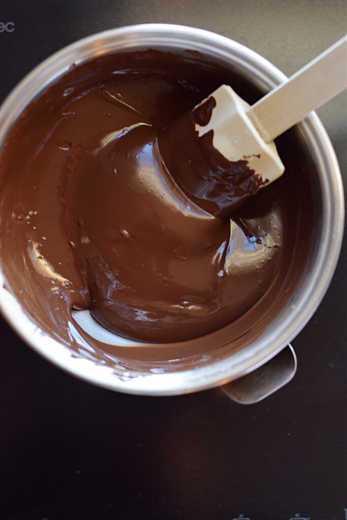 Melted chocolate in a saucepan.