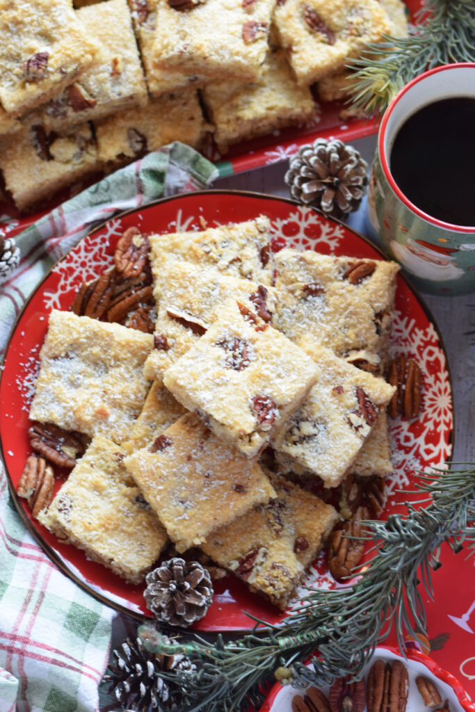 Coconut bars on a red plate.