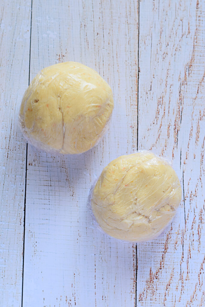 Shortbread cookie dough wrapped in two balls.