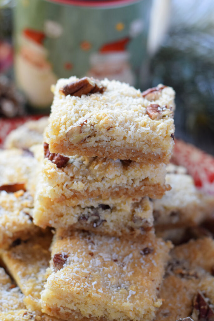 A stack of coconut pecan cookie bars.