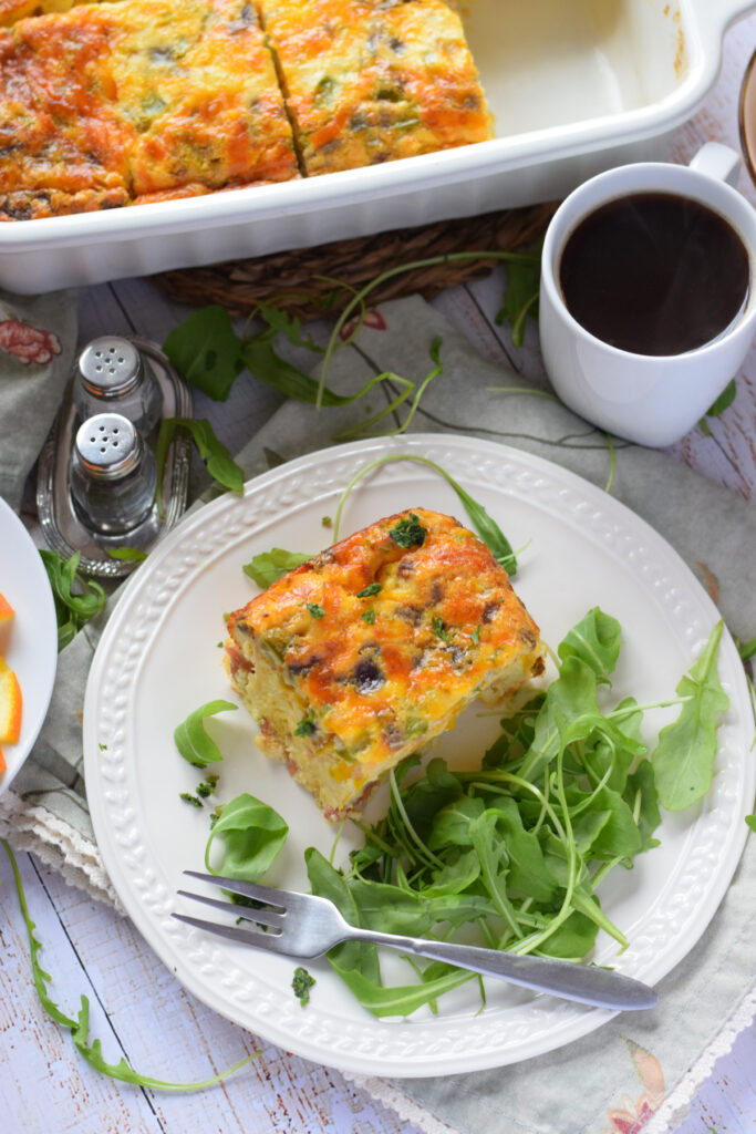 Breakfast casserole on a white plate.