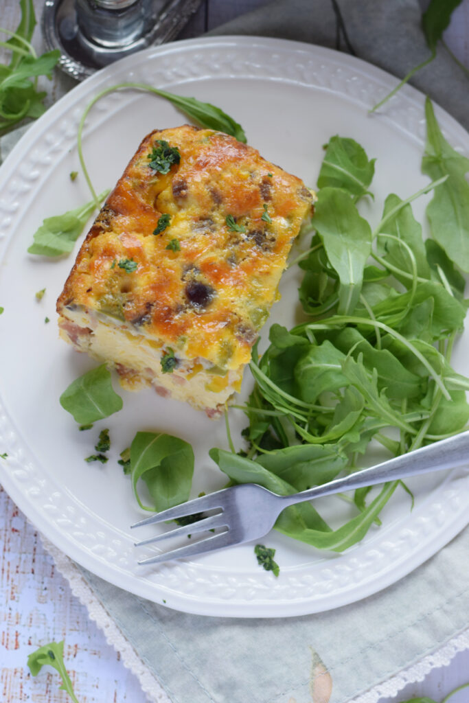 Breakfast casserole on a white plate.
