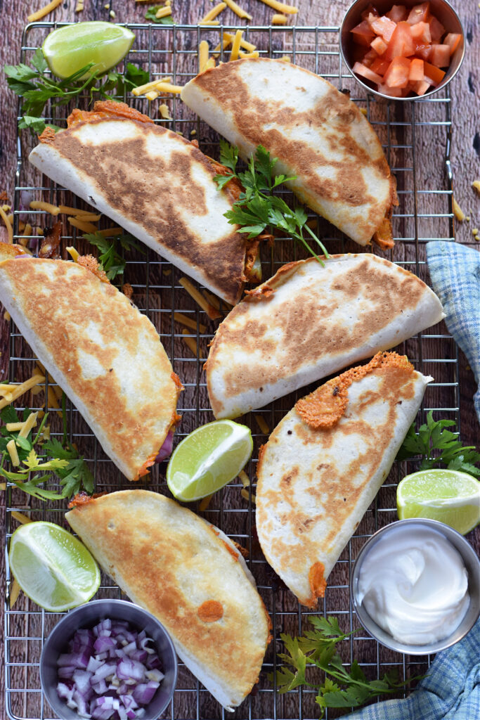 Breakfast tacos on a rack.